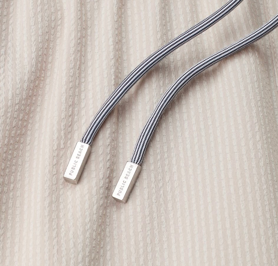 Public beach textured beige swimwear ￼